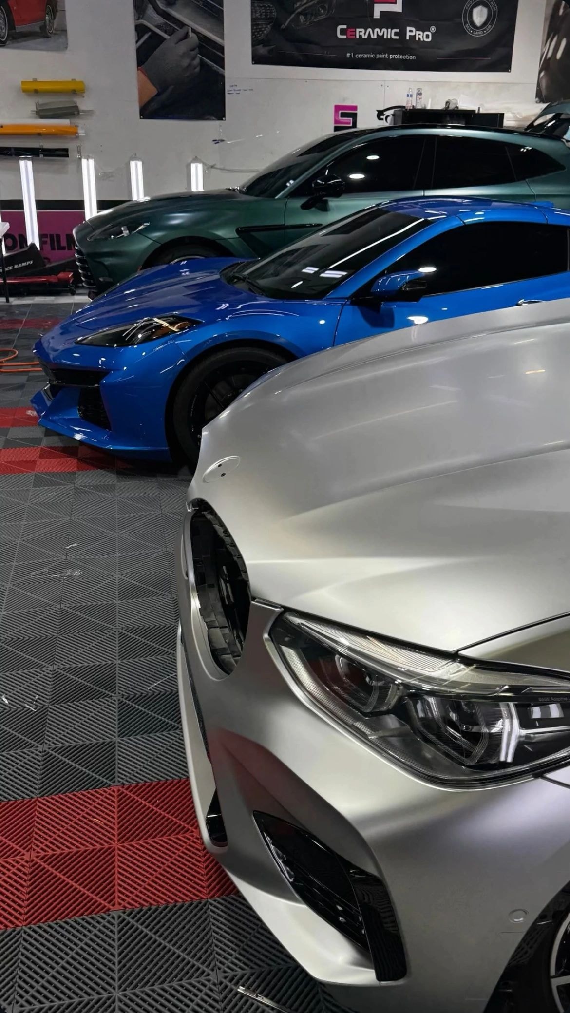 Ceramic Pro certified showroom at Tint Citi Utah with multiple luxury vehicles