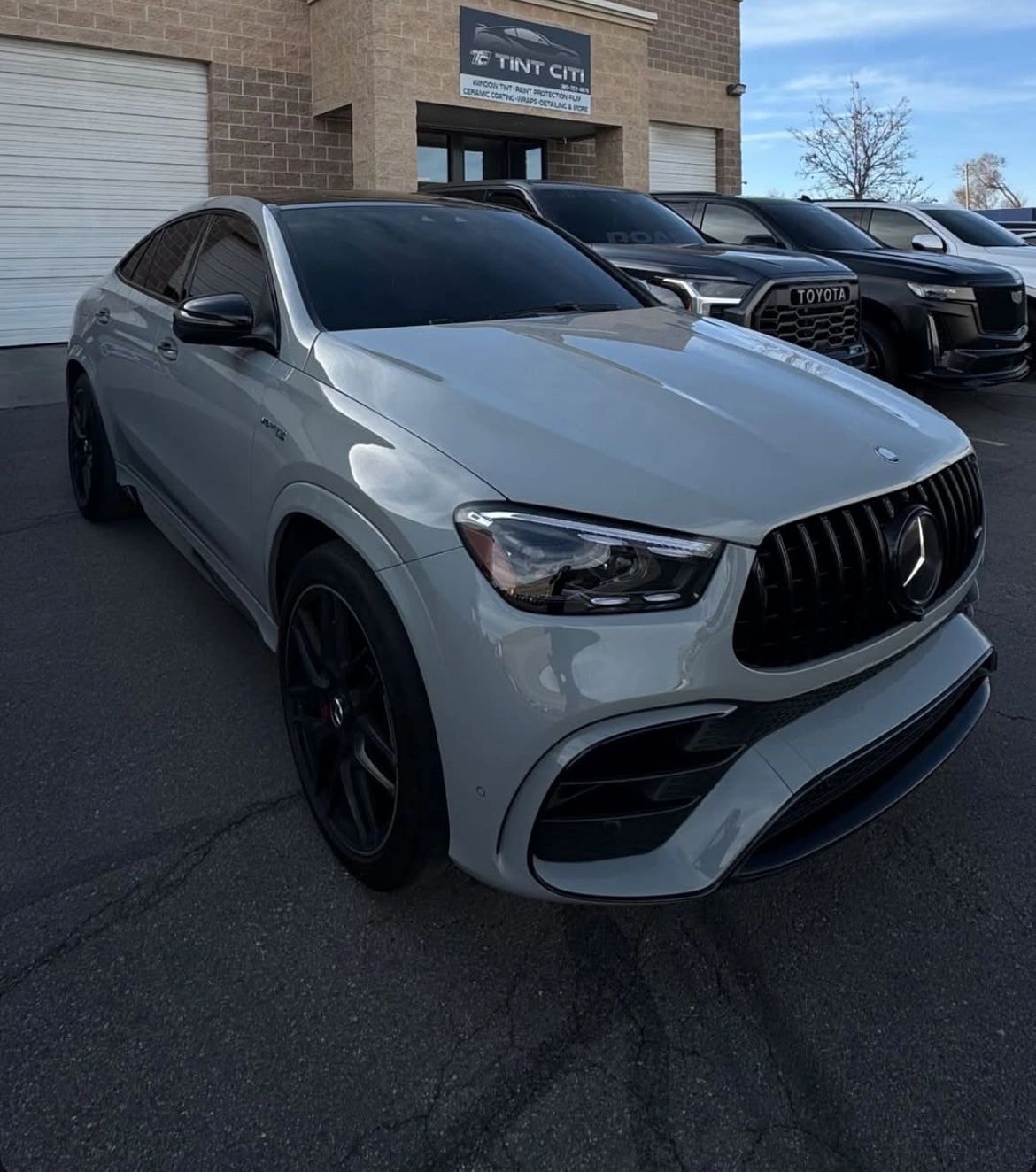White Mercedes SUV with professional window tint installed at Tint Citi Utah