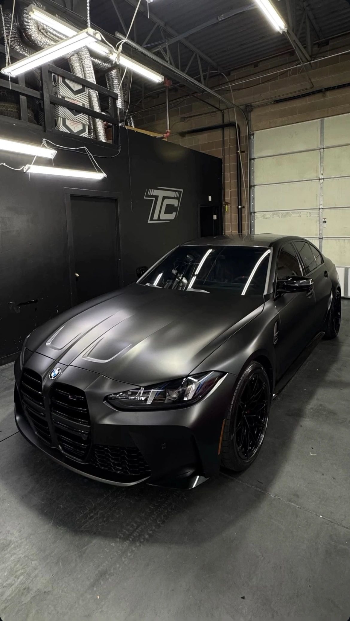BMW M340i in Tint Citi Utah garage receiving vinyl wrap service in West Valley City, Utah
